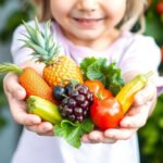 Child holding fruits and vegetables rich in B Complex Vitamins