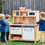 Children playing with an outdoor play kitchen